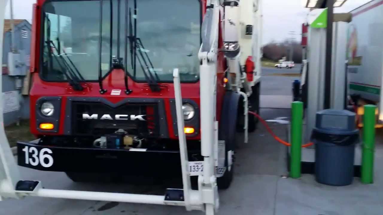 CNG refuse truck fueling up.