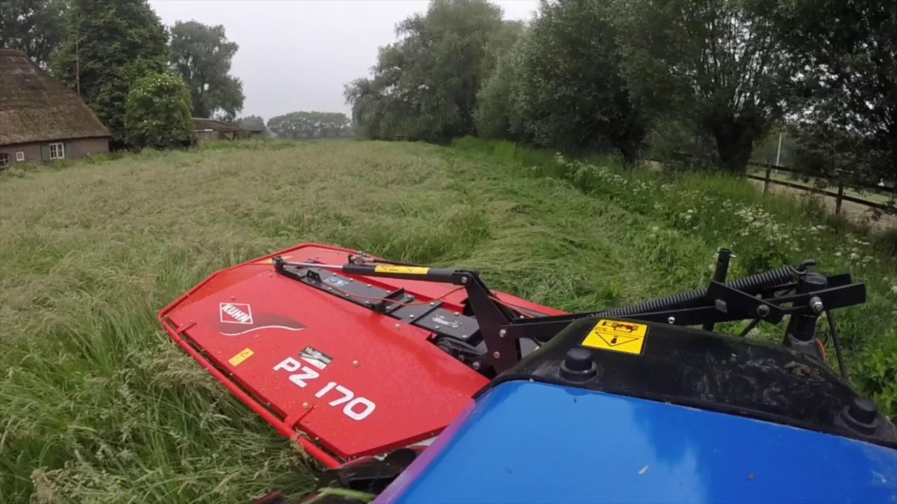 New Holland Boomer 50 with Kuhn PZ170 Drum Mower; mowing grass for hay by DutchHorseGuy