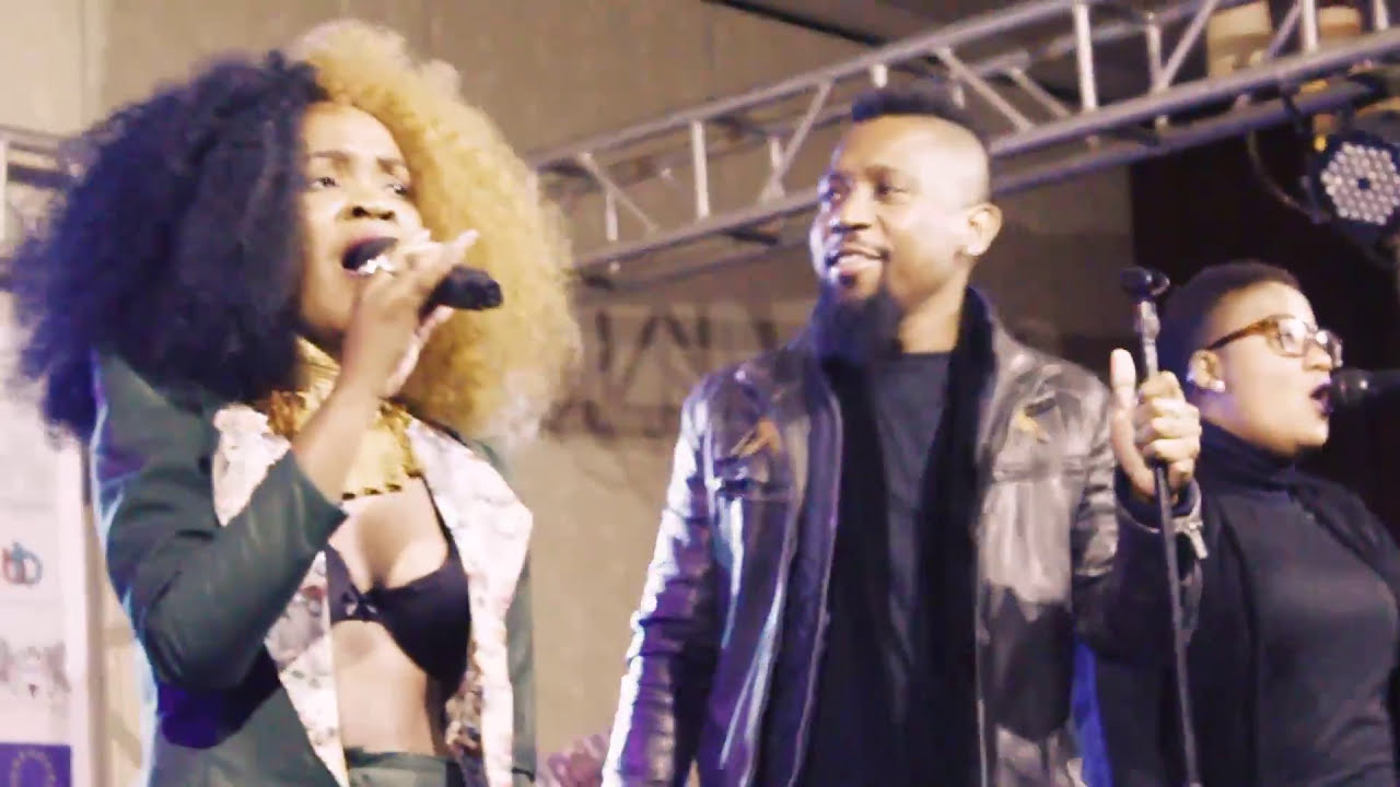 Amantle Brown performing live alongside her band at Avani