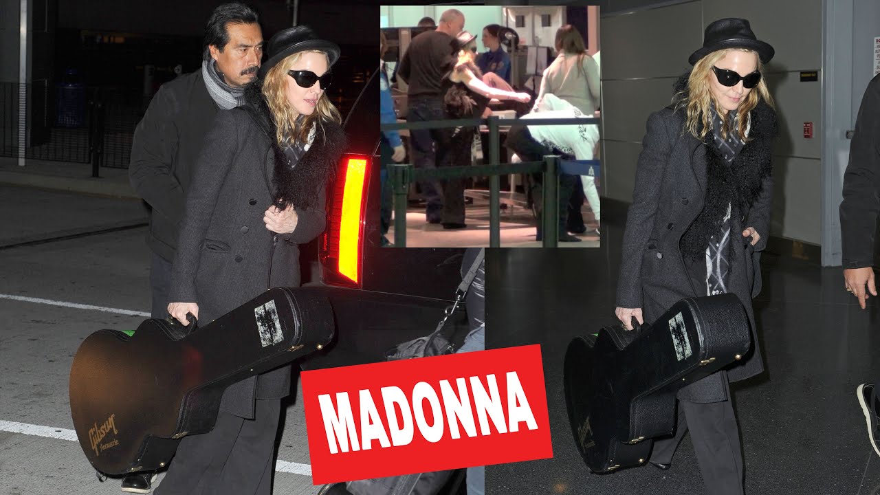 Madonna carries her Gibson guitar, shows off muscles at JFK airport