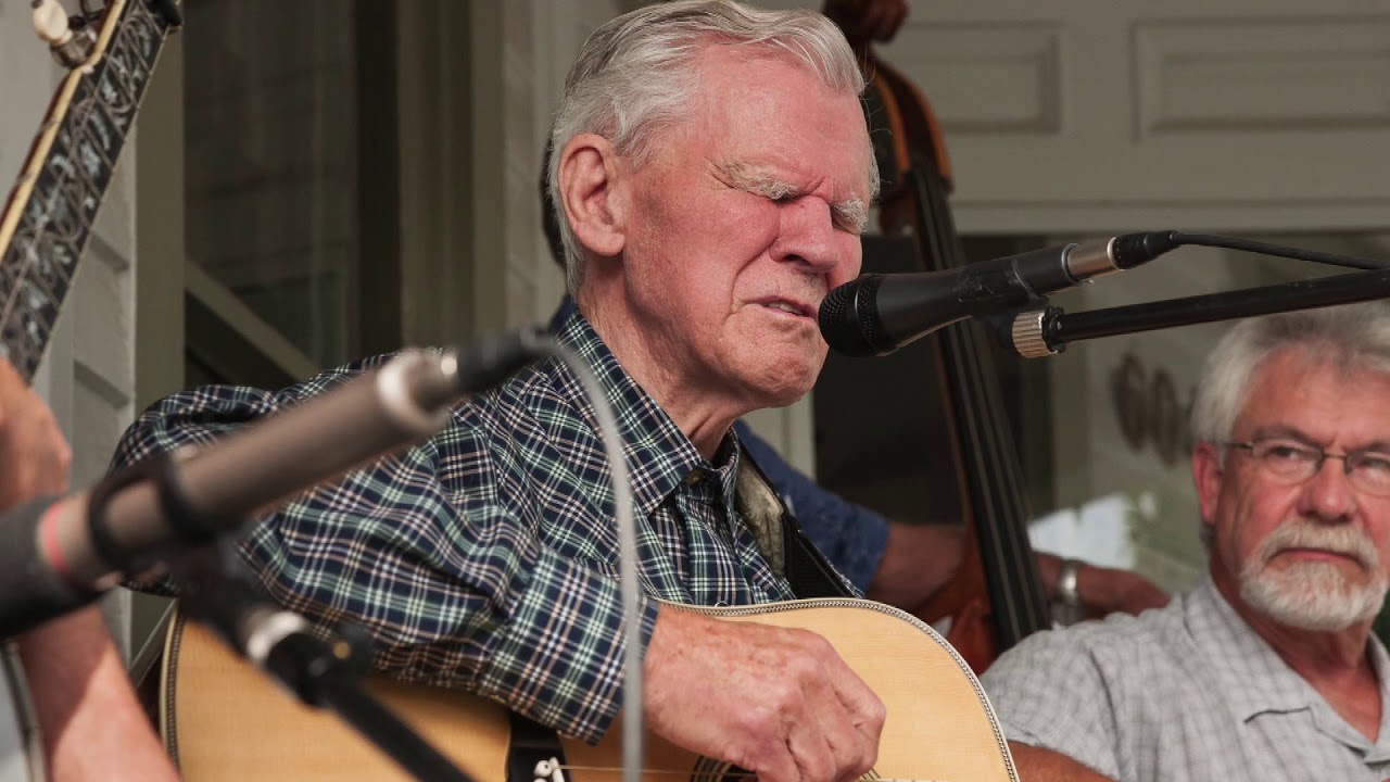 Doc Watson performs Roll On Buddy