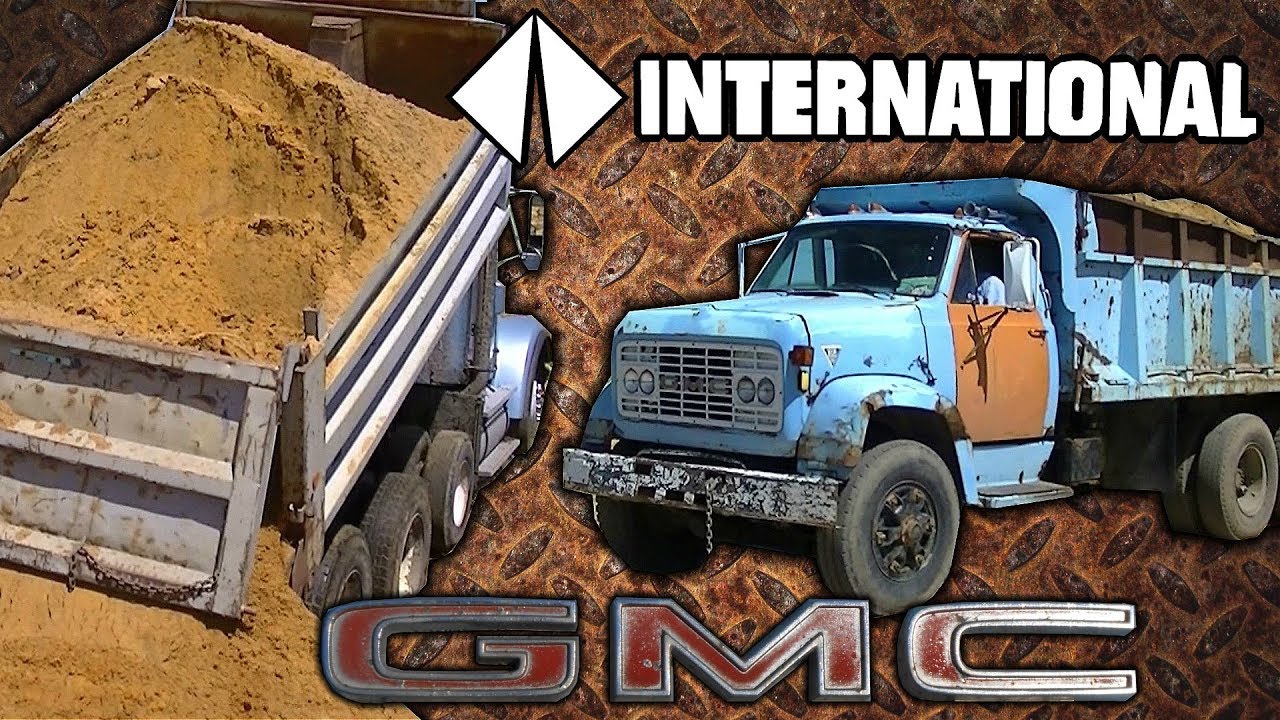 GMC Detroit Diesel and International CAT 3406 Dump Trucks Dumping Sand