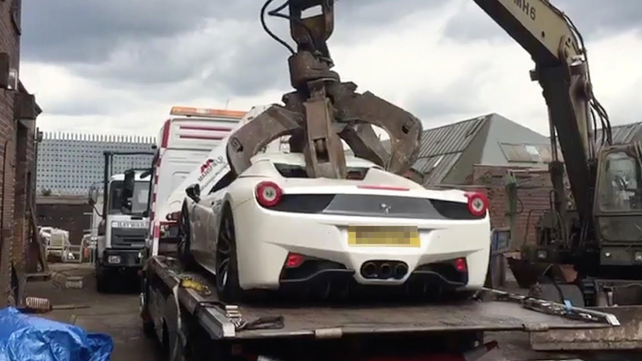 Convicted fraudster Zahid Khan's  200k ferrari 458 spider crushed by police