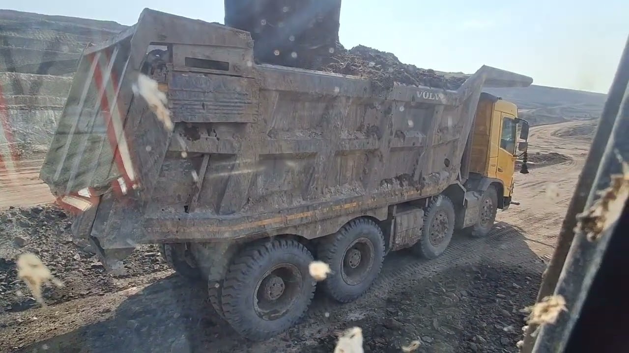 loadina mini excavator on truck