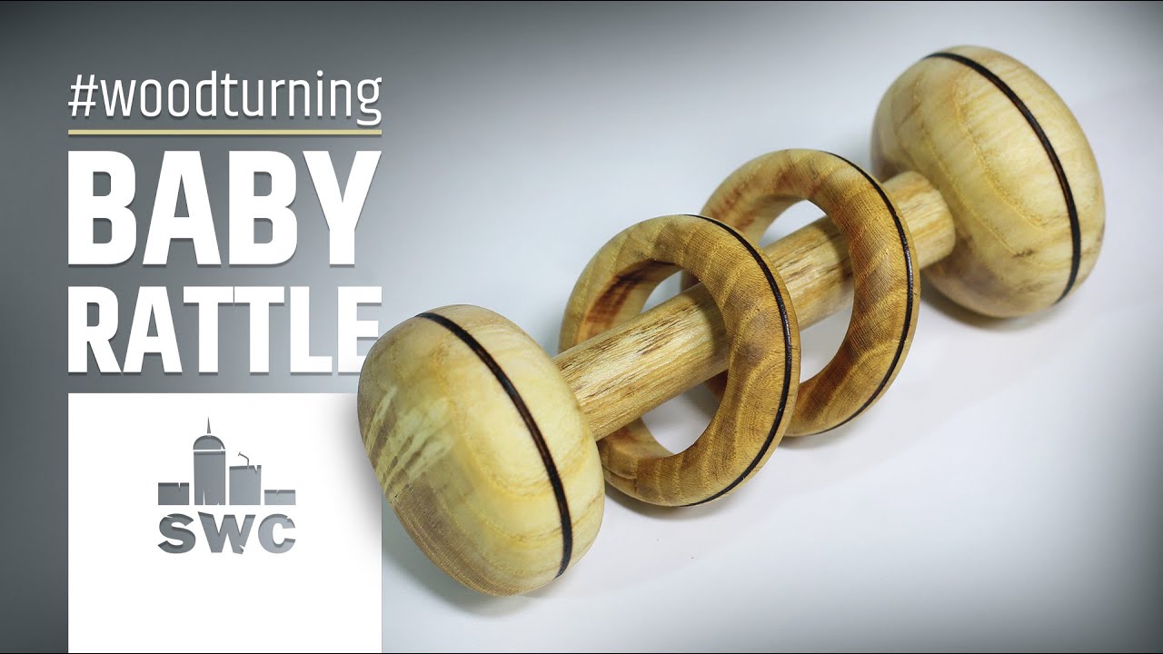 Making a baby rattle with two captive rings out of mulberry wood