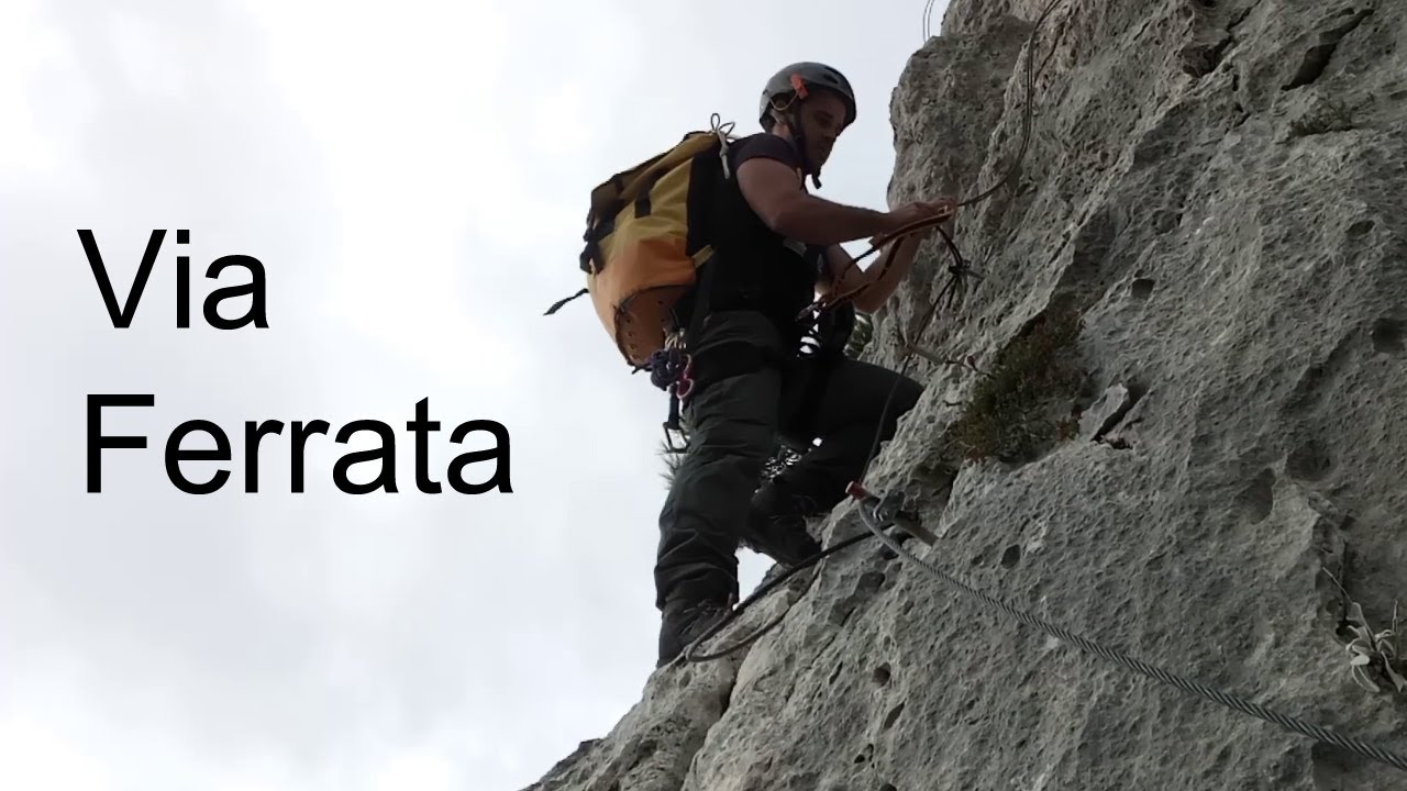 Via Ferrata trail at mount Parnitha. Passing through the edge of the cliffs.