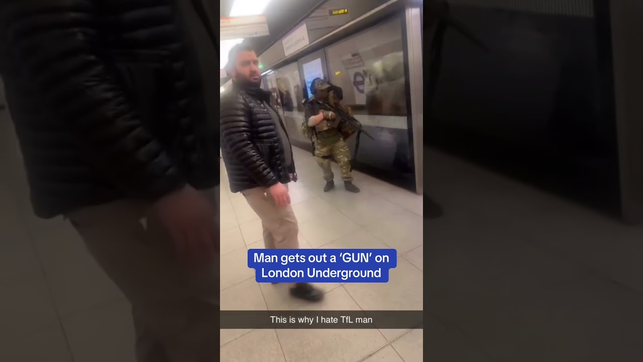 Shocking moment a man gets out a 'GUN' on London Underground