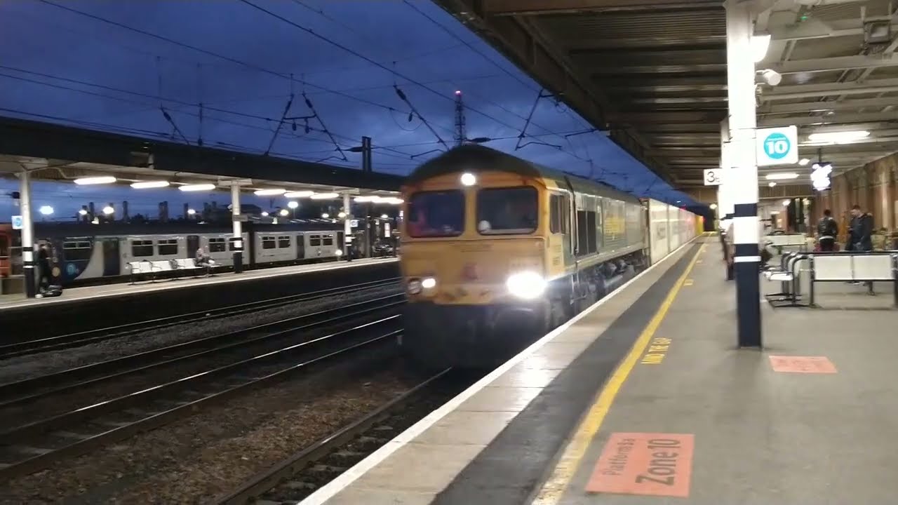 Freightliner class 66 container train passing through Doncaster station 