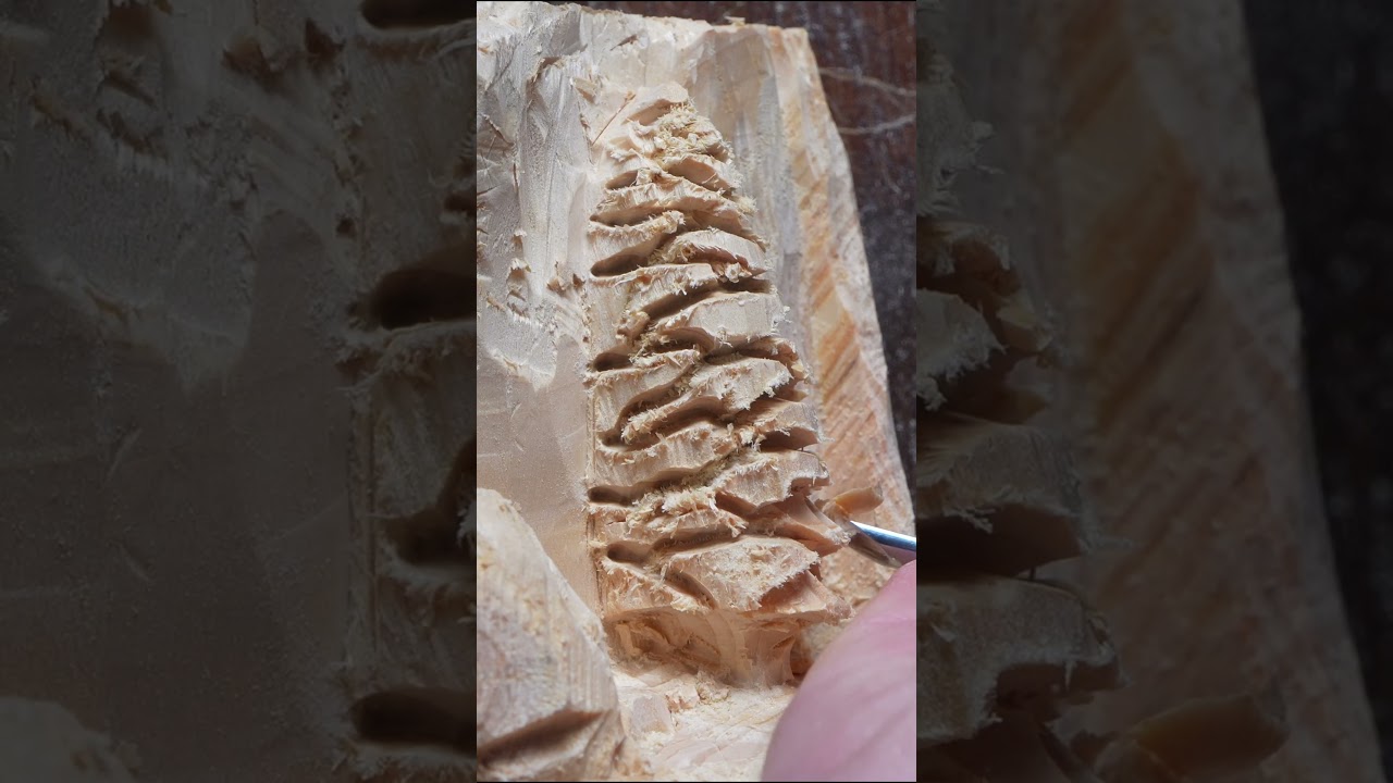 Hand carving a simple pine tree scene 