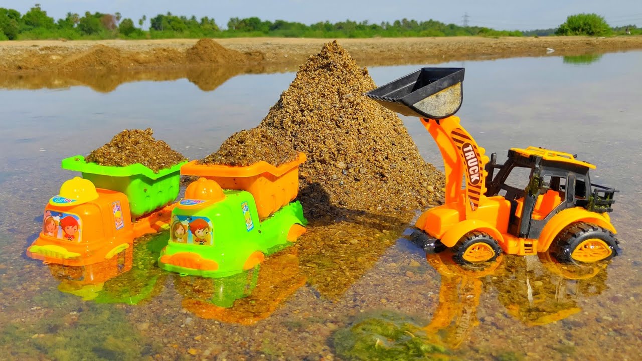 Mini Trucks River Sand Loading by JCB Machine