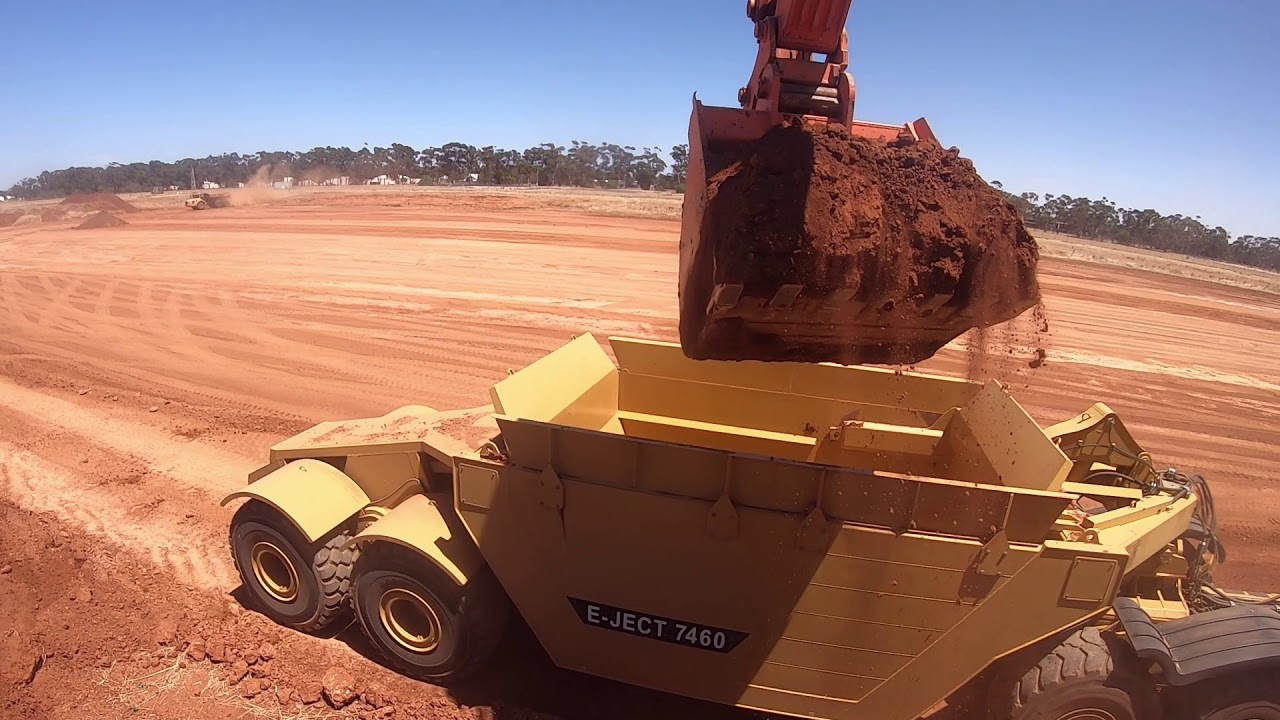 Hitachi ZX670 loading Volvo A40F Dump Trucks and Caterpillar 740B with 90 tonne E-Ject bowl