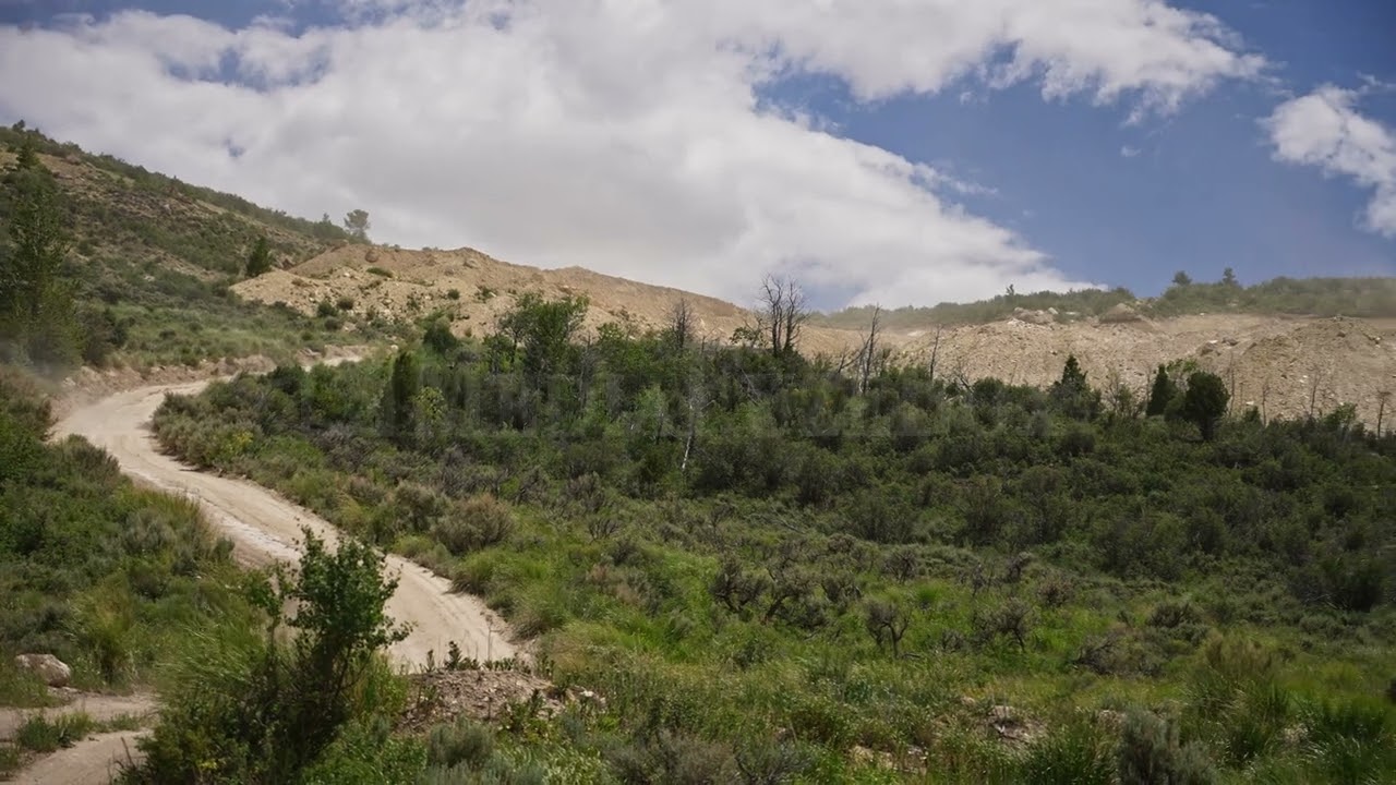 Stock Video - Panning view of fossil quarry on hillside in Wyoming