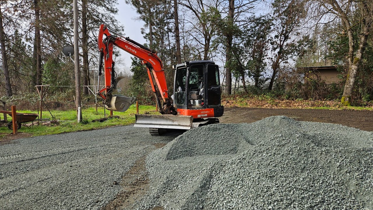 Mud parking lot gets gravel with the Kubota KX 040 4 excavator