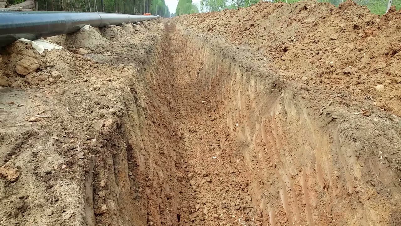 Как копать траншею с откосами на экскаваторе