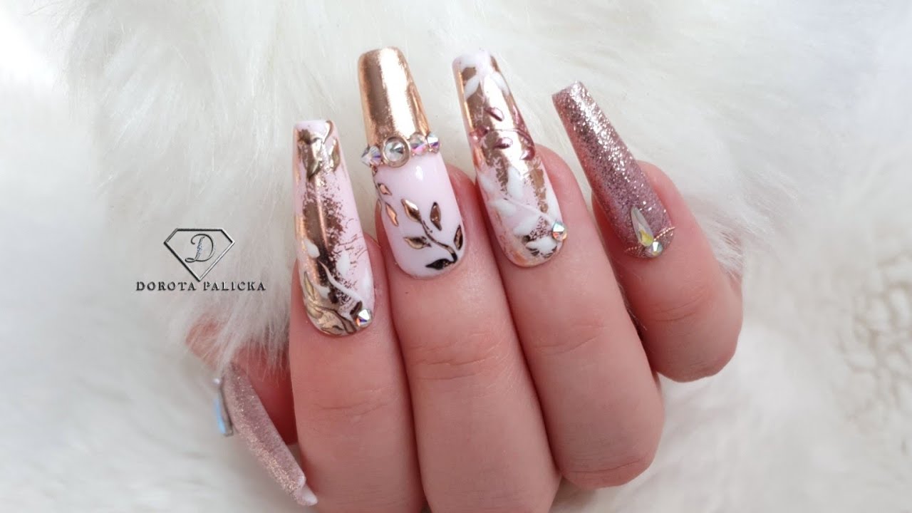 Rose gold and nude nails with transfer foil and chrome pigment.