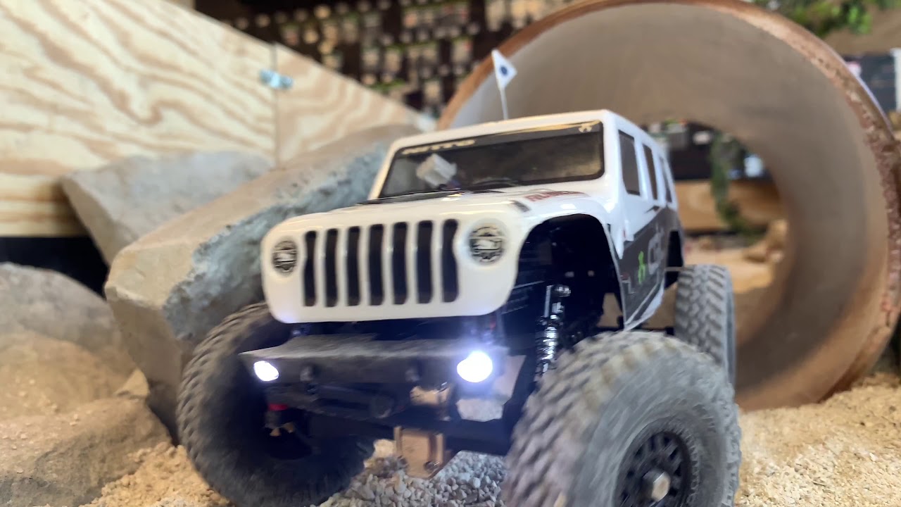 Axial Scx24 crawling at radio controlled revolutions indoor course