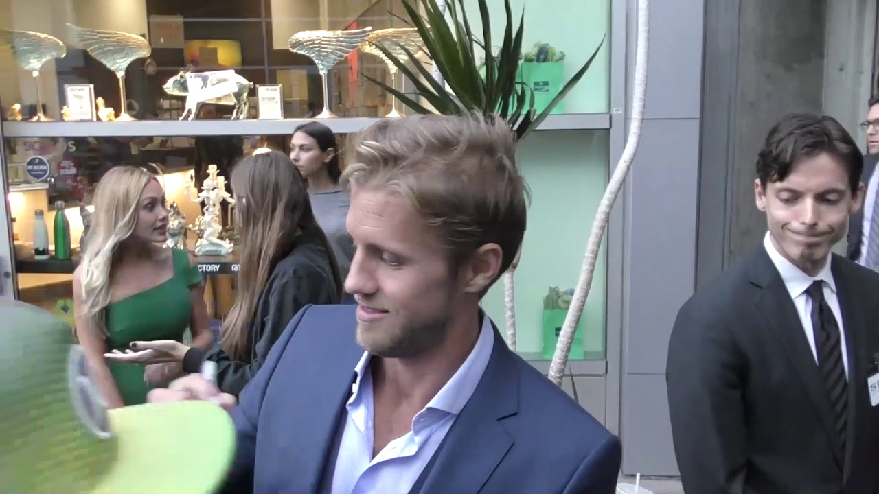 Matt Barr talks about his movie The Layover outside ArcLight Theatre in Hollywood
