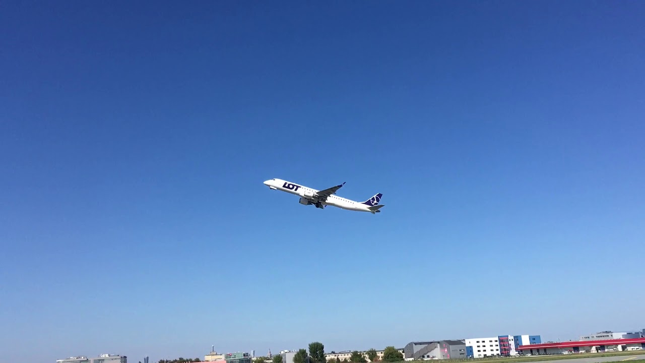 LOT EMBRAER ERJ-195 take off at Chopin airport in Warsaw