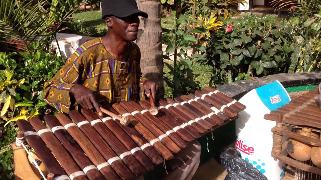 African Village, Bakau, playing the Balafon (pitched idiophone)