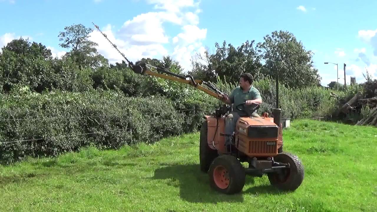 Kubota B8200 and mc connel swing trim hedge cutter for sale
