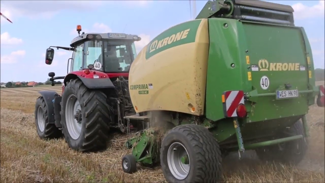 MF 7719 S mit Krone Comprima im Stroh.