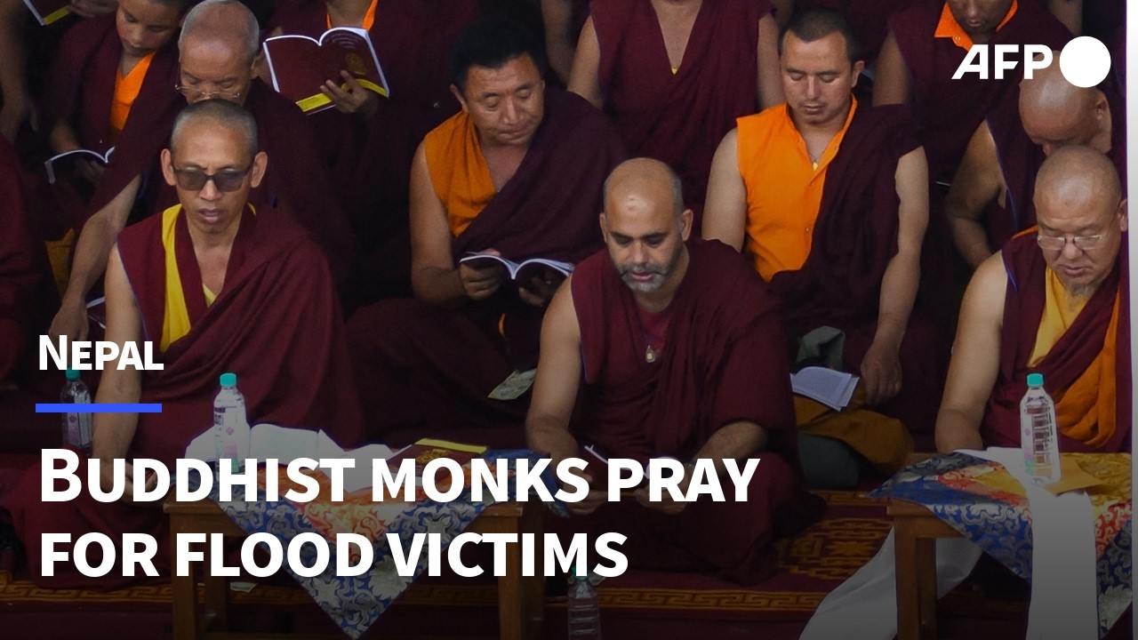 Buddhist monks offer prayers for Nepal flood victims | AFP