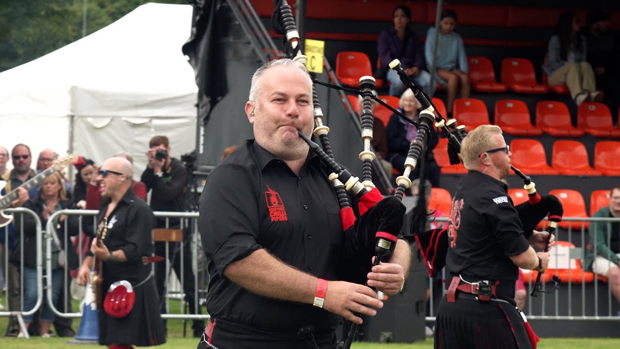 Red Hot Chilli Pipers Bagrock the 2024 City of Perth Salute with Pipes & Drums in Scotland