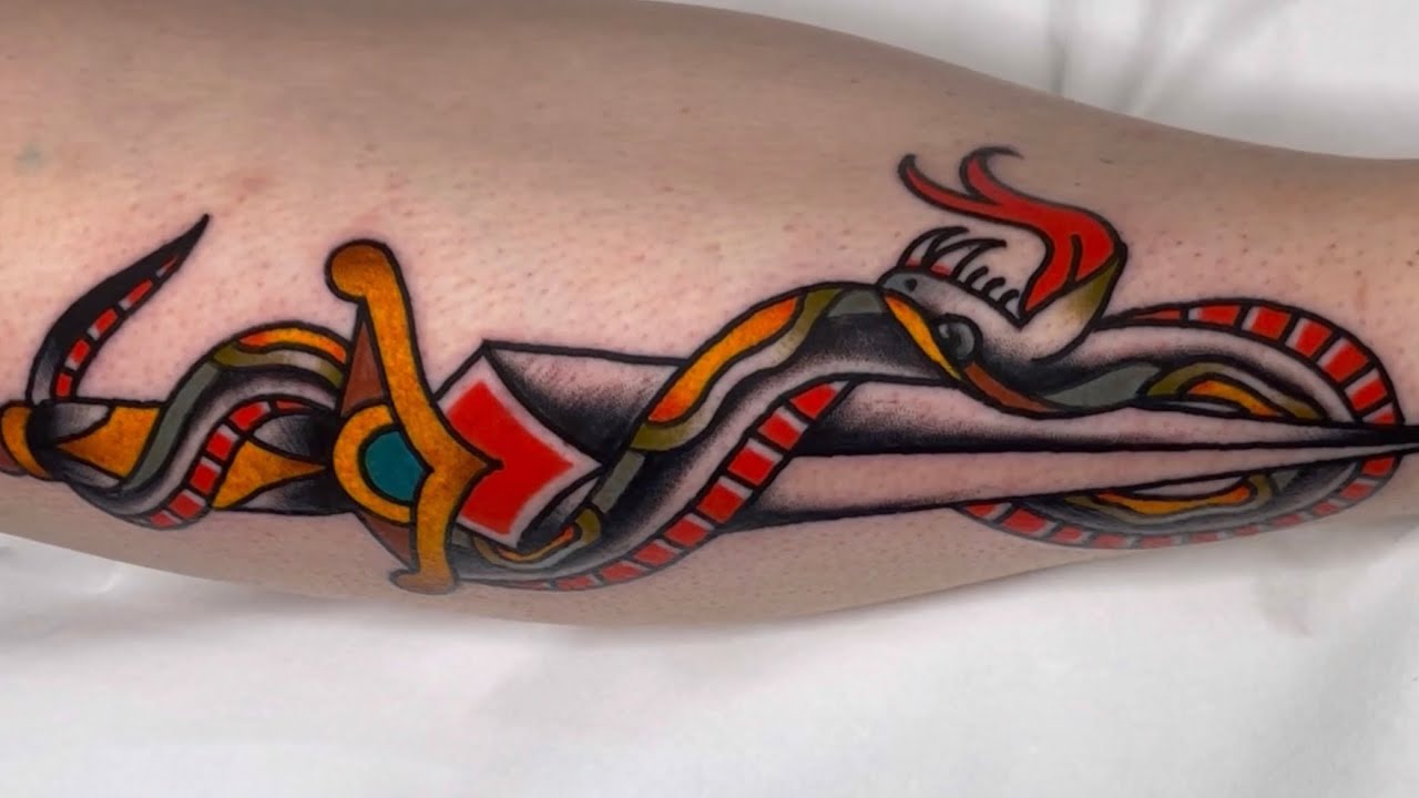 Traditional dagger snake tattoo by Jorge Ramirez - real speed tattooing