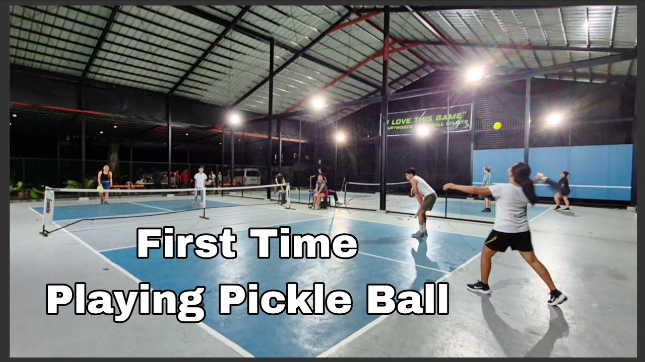 PLAYING PICKLE BALL , EXCITING GAME