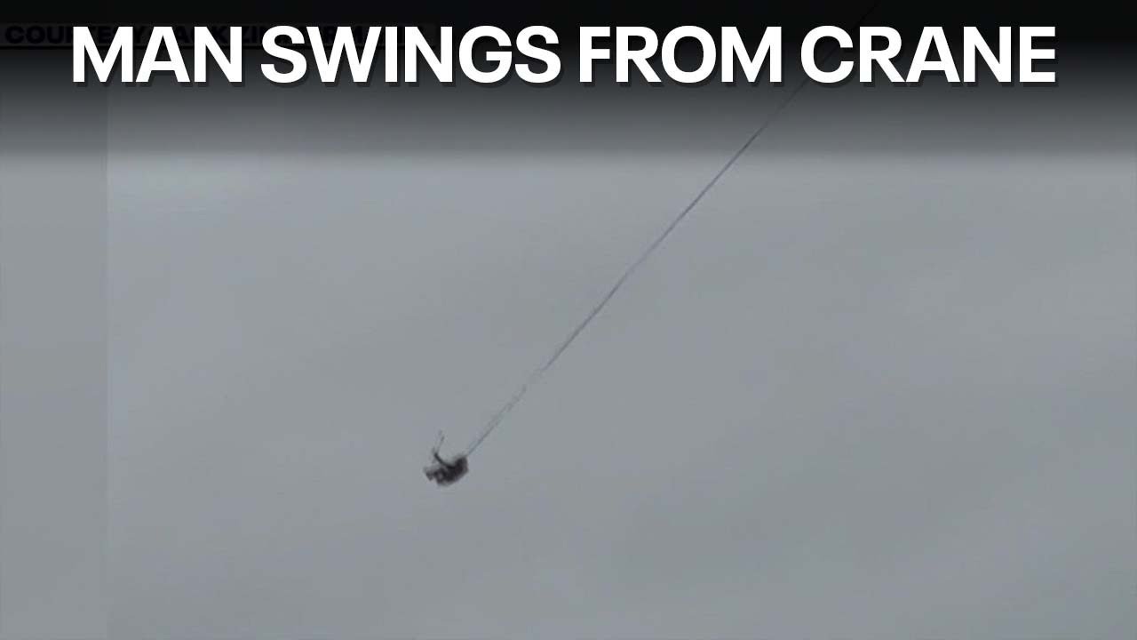 Man swings from downtown Austin construction crane | FOX 7 Austin