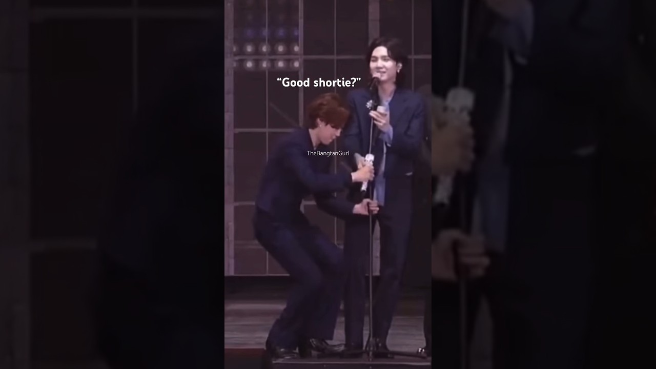Jimin helping Suga with his mic problems. Aww poor Yoongi, too short 😅