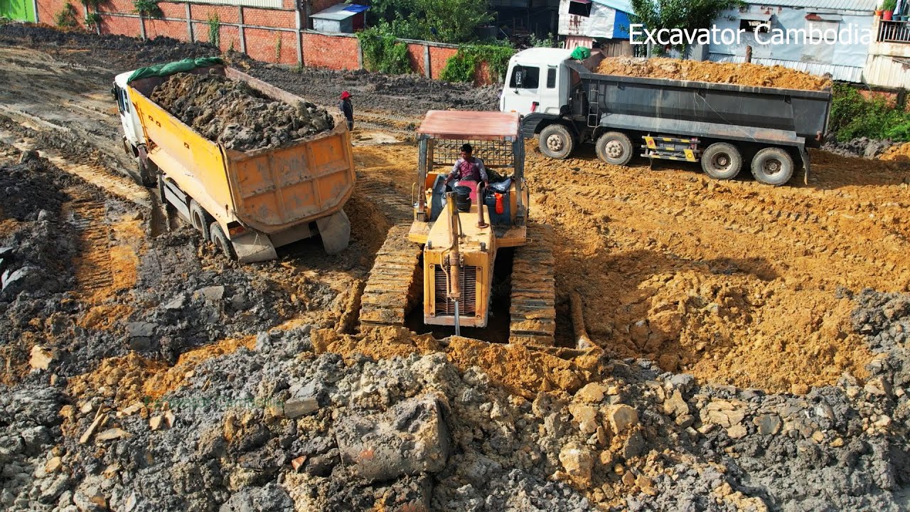 Special Skills Driver Bulldozer Working Cutting Mud And Soil At Difficult - Truck Working Unloading