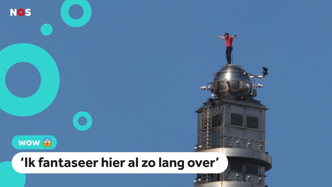 Wow! Man beklimt megahoog gebouw zonder touw