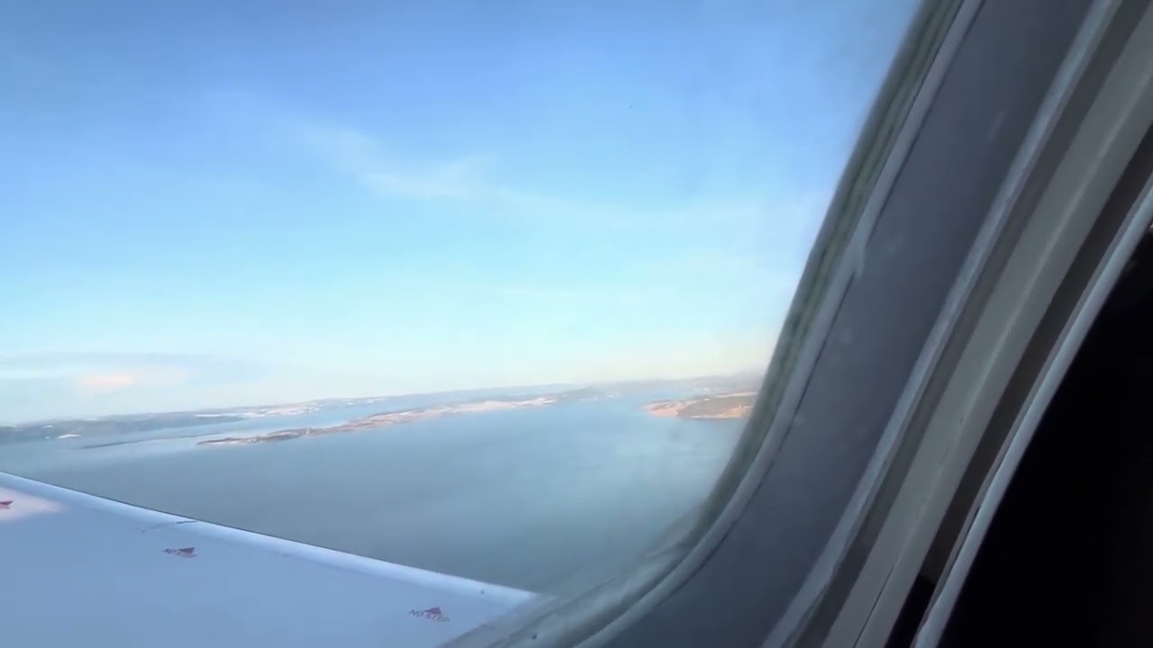 Approach and landing in Trondheim from Copenhagen in a beautiful winter day 