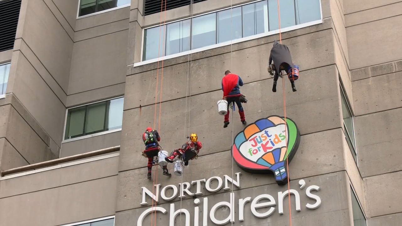 'Superheroes' wash windows in annual Norton Children's Hospital event