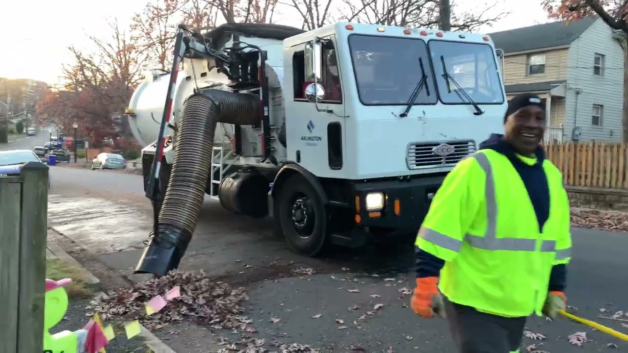 CCC Leaf Vacuum Truck Packing Piles at Sunset