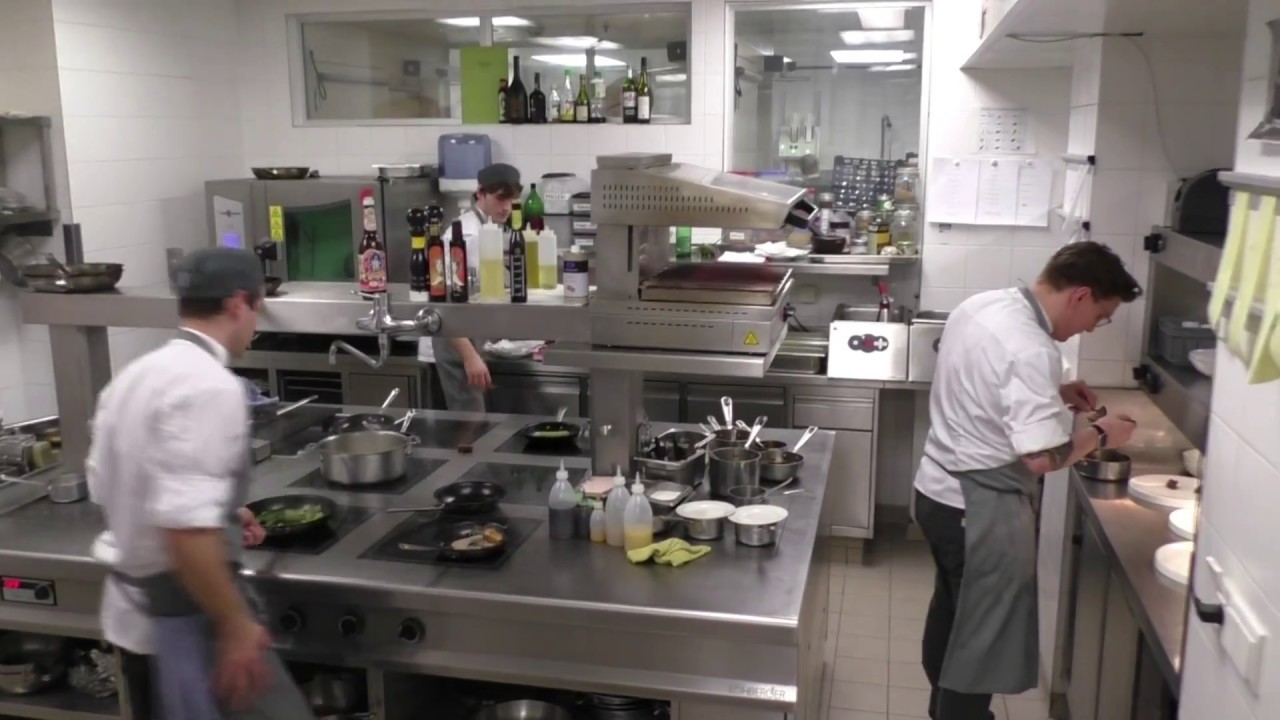 A busy kitchen at the Edvard restaurant at the luxury hotel Palais Hansen Kempinski