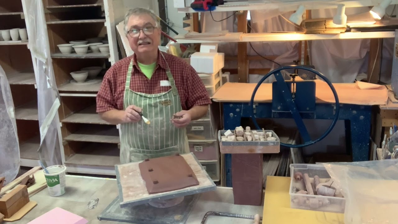 Making 4 hand built platters, decorated with slips.