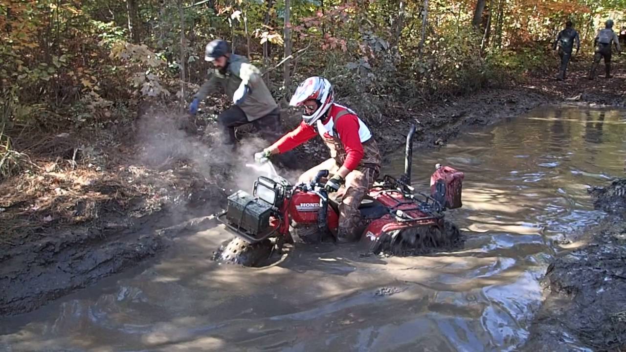 1985 Honda Big red Three Wheeler going thru a mud hole