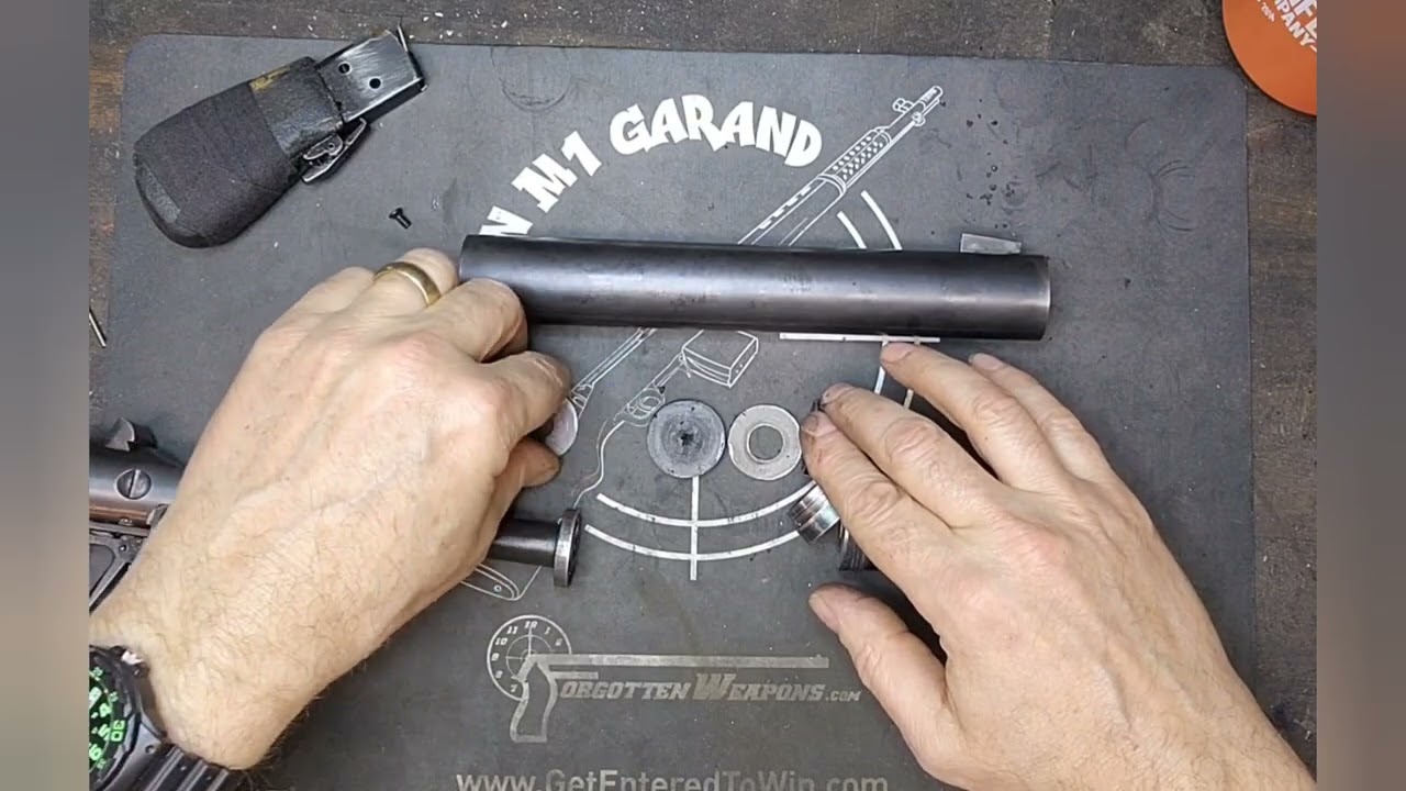 Внутреннее устройство глушителя для пистолета Welrod и тест на стрельбище.