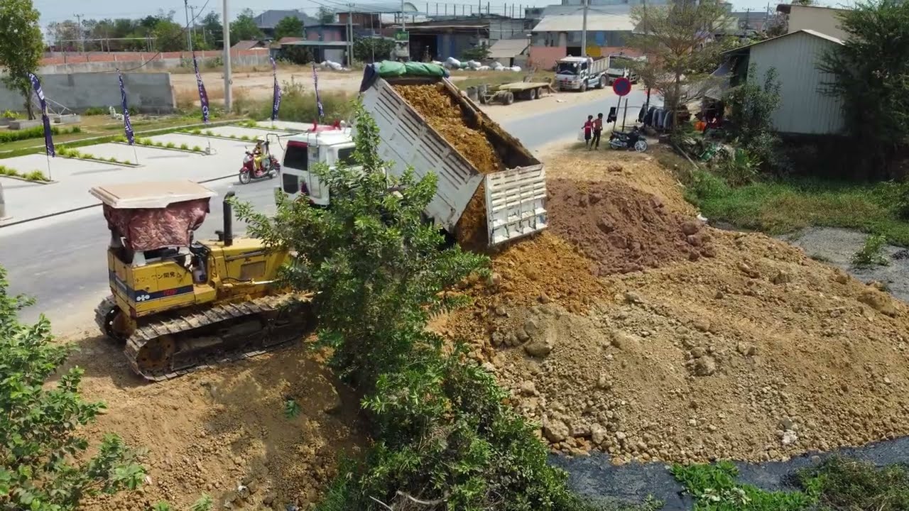 Start new project! Technique Land filling With Bulldozer KOMATSU D31P And Dump Trucks