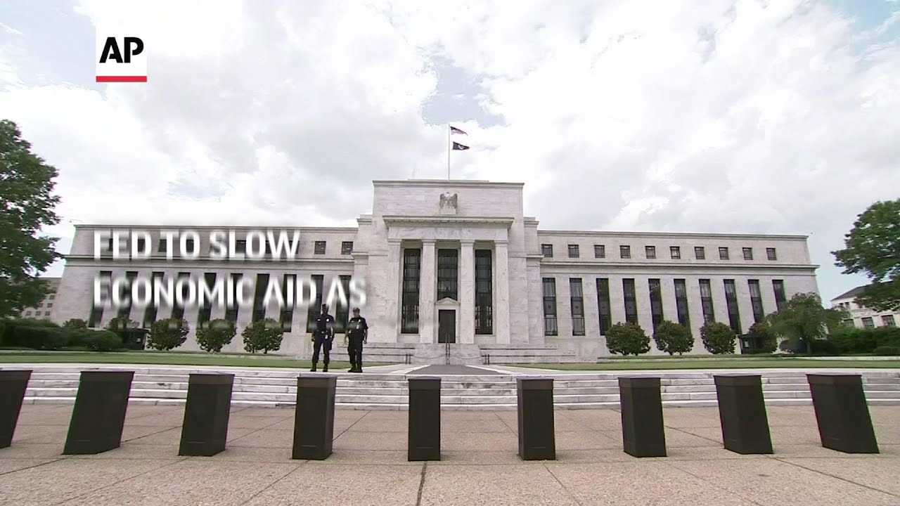Fed to slow economic aid as inflation fears rise