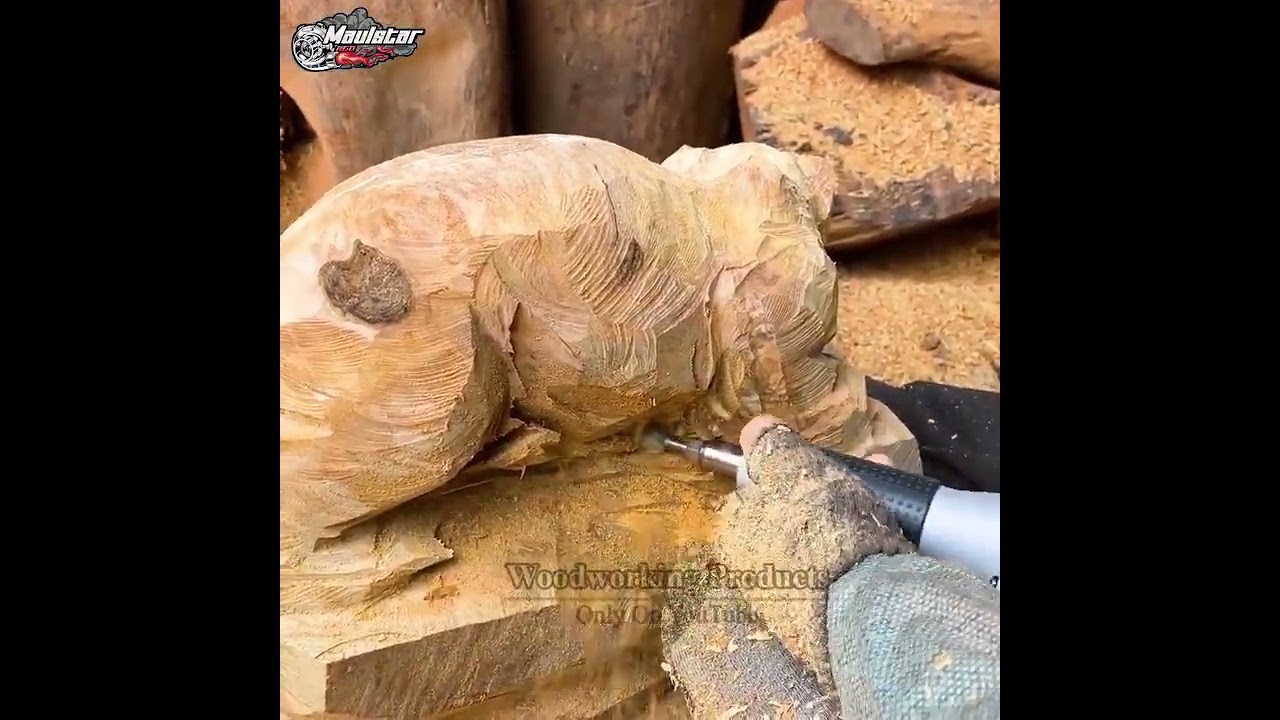 The Skillful Hands Of The Young Carpenter Carved The Image Of A Leopard From A Rough Piece Of Wood