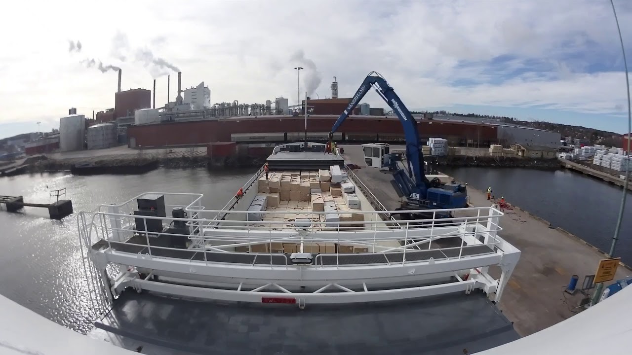 General cargo vessel loading timber