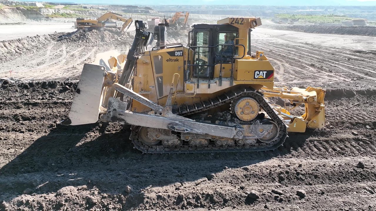Caterpillar D9T Bulldozer Ripping And Pushing Soil On Huge Coal Mining Site - 4k
