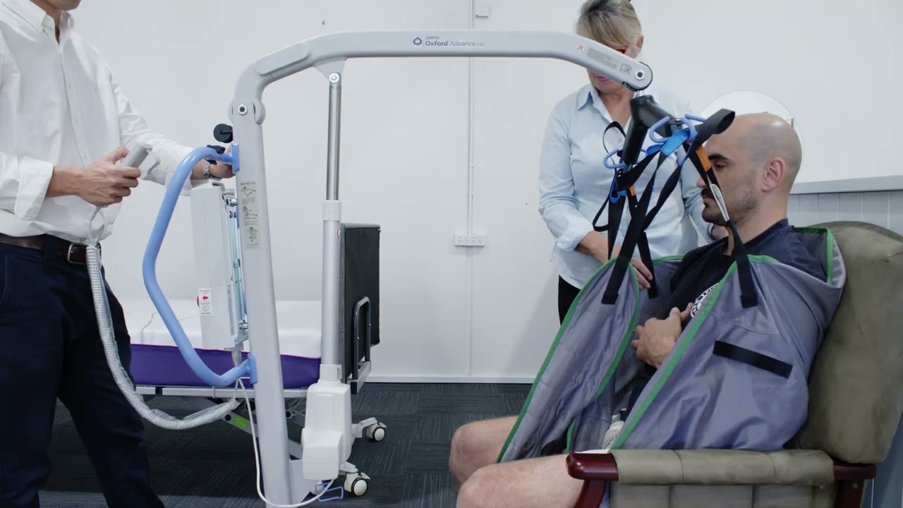 Moving a Patient from a Chair to a Bed (Electronic Hoist Demonstration)