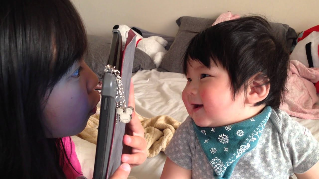 9 month old cute happy Japanese laughing baby.