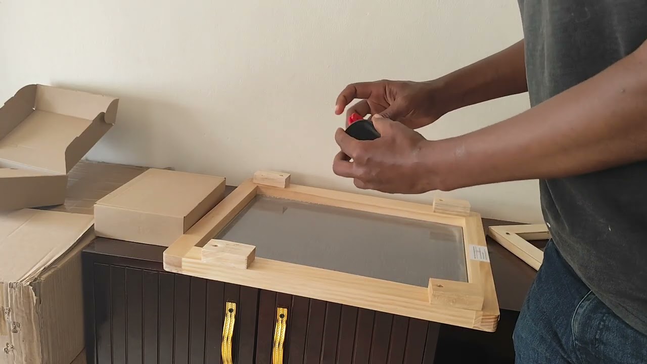 Modifying a venom collection machine to collect bee venom externally from a topbar hive. 