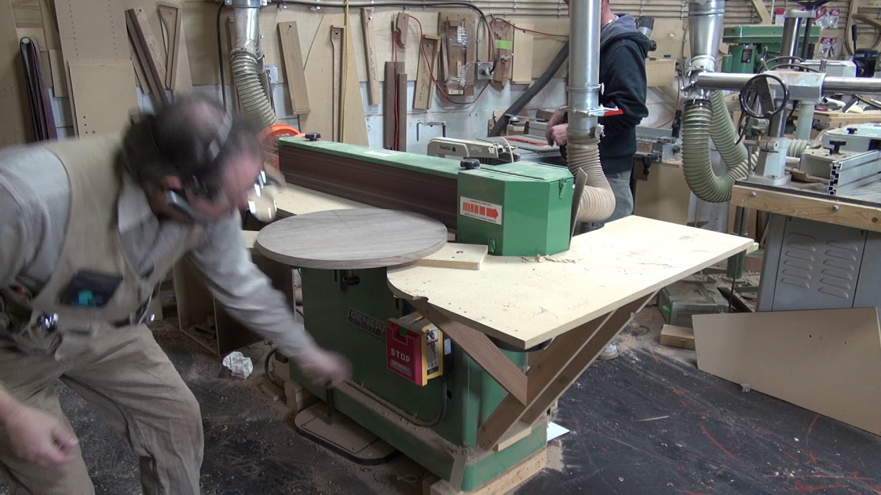 edge sanding round tops on an edge sander