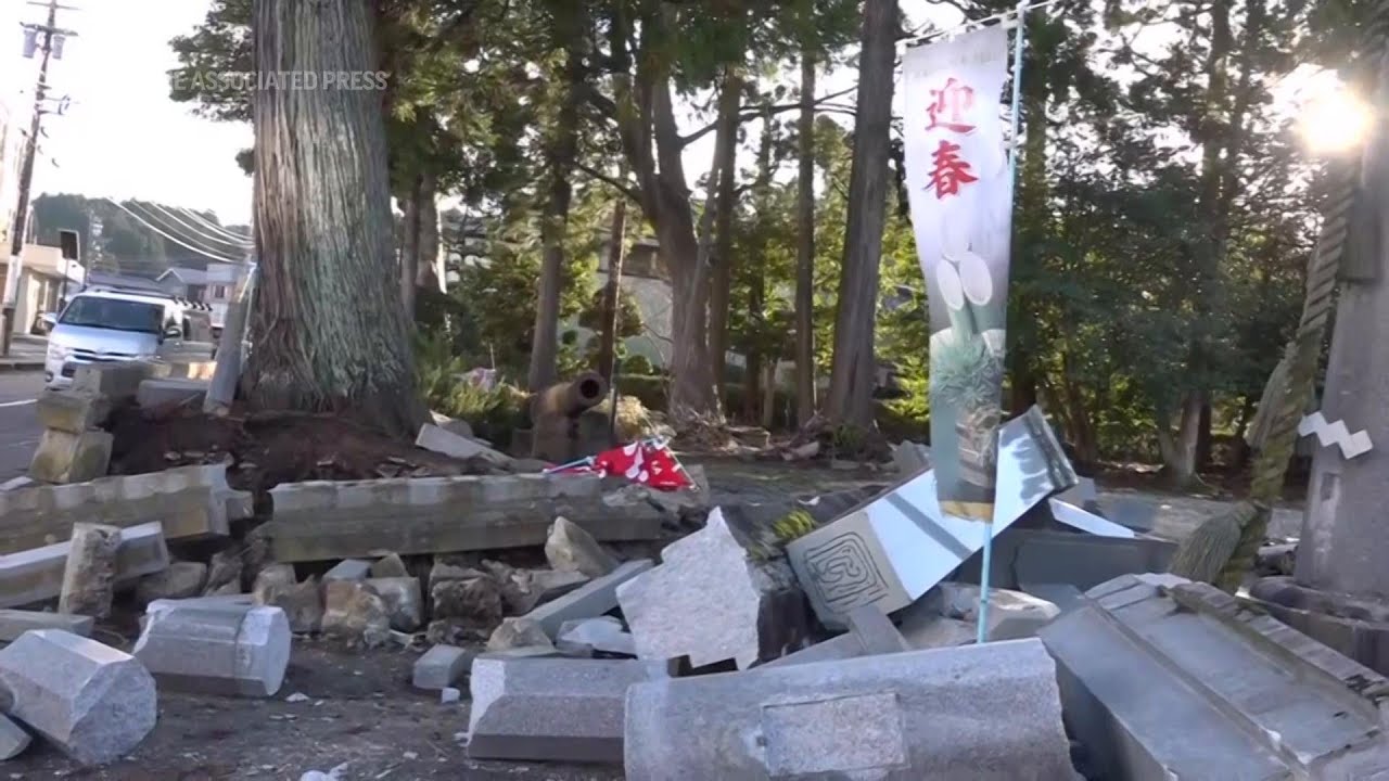Scenes of loss play out on Japan's western coastline in aftermath of quake that killed over 80